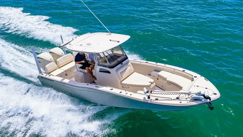 Slide: The Image of Aerial View of Bow and Helm The 2024 Grady-White 281 CE showcases its sleek design with an expansive bow area featuring comfortable seating and ample space for relaxation. The helm is equipped with state-of-the-art controls, ensuring a smooth and enjoyable navigation experience. The - 7766898