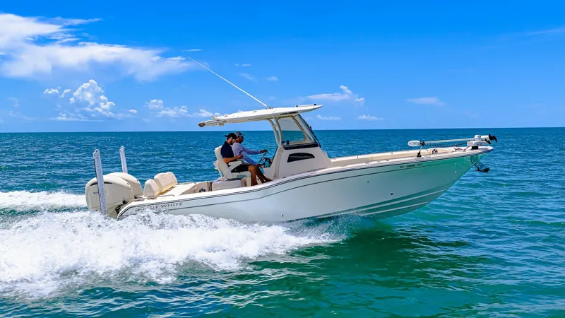 Slide: The Image of Grady-White 281 CE in Action The 2024 Grady-White 281 CE showcases its sleek hull design as it cuts through the water with ease. Featuring a spacious center console layout, this model offers both comfort and functionality for a day on the ocean. Equipped with advanced navigation and - 7766909