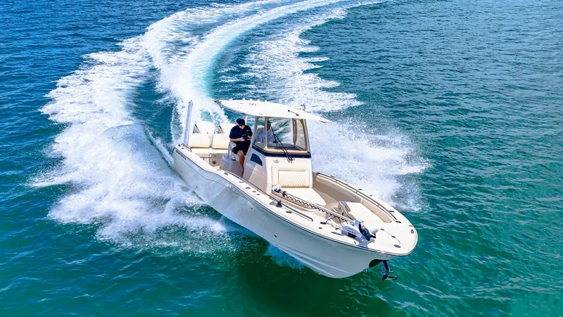 Slide: The Image of Dynamic Bow View in Action The 2024 Grady-White 281 CE is captured in motion, showcasing its sleek bow design slicing through the water with ease. This powerful vessel features a spacious open deck, perfect for both fishing and leisure activities. Its robust hull and advanced navig - 7766902