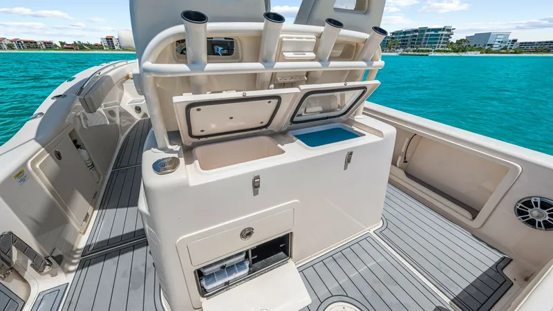 Slide: The Image of Fishing Station with Tackle Storage The 2024 Grady-White 281 CE features a well-equipped fishing station, complete with rod holders and ample tackle storage. The station includes a convenient bait-prep area and easy-to-access compartments, perfect for avid anglers. The sleek, non-slip decki - 7766881