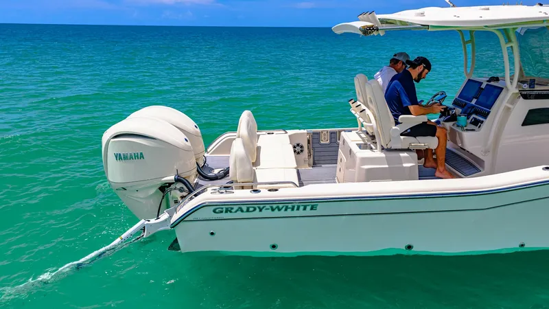 Slide: The Image of Cockpit and Helm Station The 2024 Grady-White 281 CE showcases a well-appointed cockpit and helm station, perfect for navigating open waters. The dual console design features comfortable seating and advanced navigation systems, ensuring a smooth and enjoyable ride. With a powerfu - 7766864