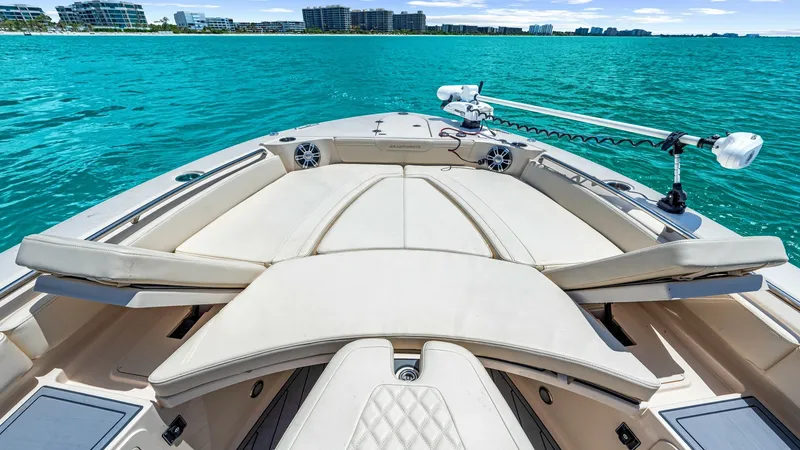 Slide: The Image of Spacious Bow Seating Area The 2024 Grady-White 281 CE features a spacious bow seating area with luxurious cushioning and elegant diamond stitching. This inviting space is perfect for relaxing and enjoying panoramic views of the water. Equipped with high-quality speakers and a trol - 7766888