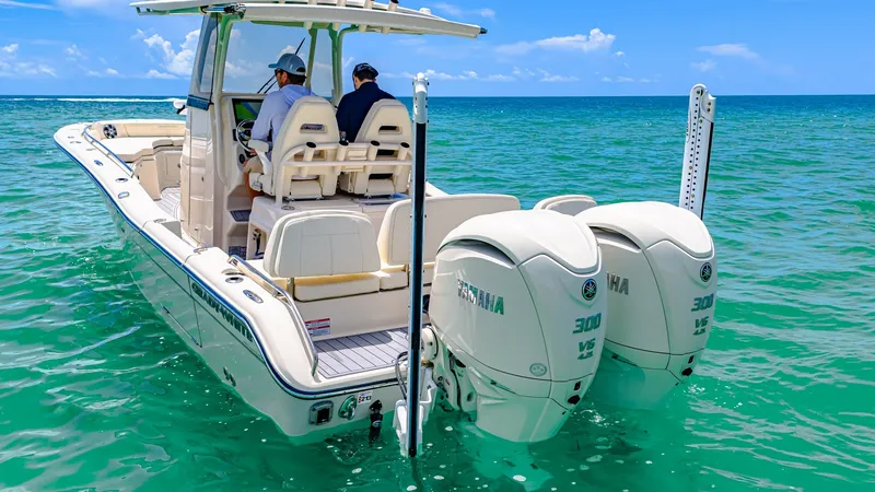 Slide: The Image of Aft View with Dual Engines The 2024 Grady-White 281 CE showcases its powerful dual Yamaha 300 V6 engines, designed for optimal performance and efficiency. The spacious aft deck offers ample seating and easy access to the water, enhancing both comfort and functionality. With its sle - 7766852