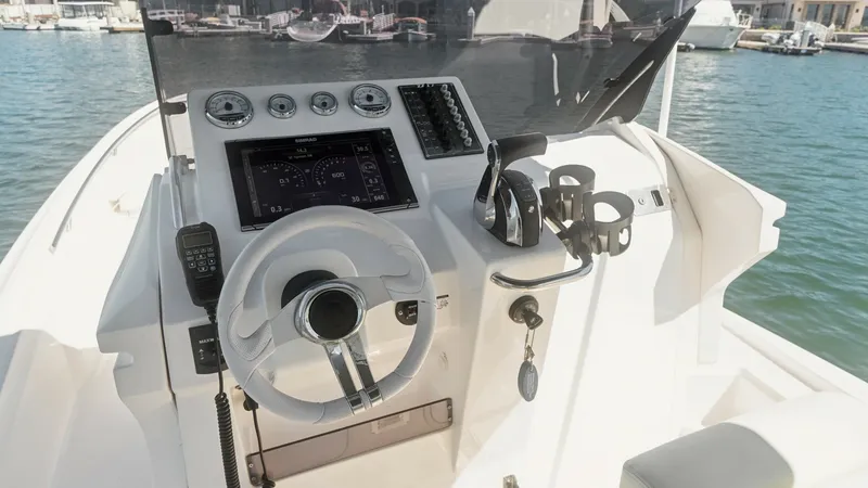 Slide: The Image of Helm Station with Modern Controls The helm station of the Zar Formenti 85 SL showcases sleek, modern controls with a prominent steering wheel and advanced navigation system. The dashboard features clear instrumentation and a state-of-the-art display, ensuring precise handling and easy mon - 7766818