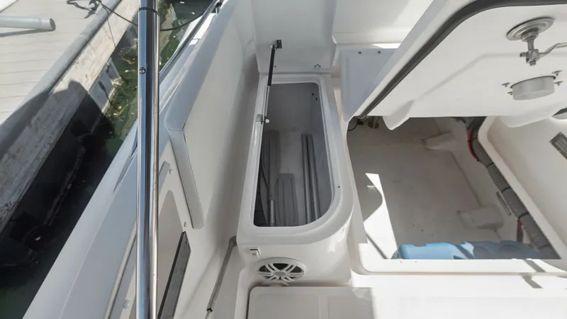 Slide: The Image of Aft Deck Storage Compartment The aft deck of the Zar Formenti 85 SL features a spacious storage compartment, perfect for securing gear and essentials. The compartment's sleek design integrates seamlessly with the deck layout, offering easy access and ample space. High-quality materia - 7766827