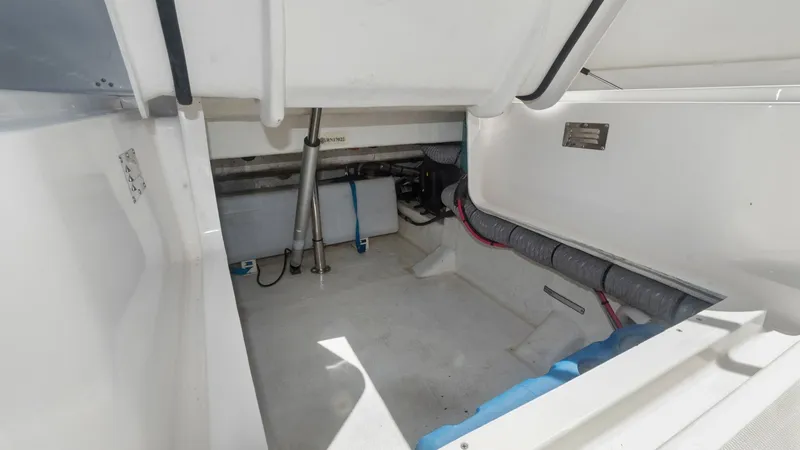Slide: The Image of Spacious Under-Deck Storage Compartment This image showcases the spacious under-deck storage compartment of the Zar Formenti 85 SL. The compartment is designed for easy access and organization, featuring durable materials and ample room for equipment and supplies. The hydraulic struts ensure sm - 7766828