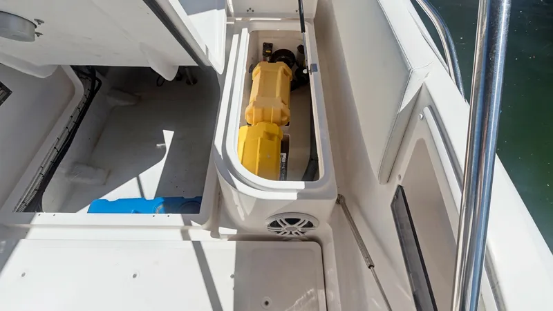 Slide: The Image of Aft Deck Storage Compartment This image showcases the aft deck storage compartment of the Zar Formenti 85 SL. The compartment is spacious, ideal for stowing essential gear and equipment securely. Its design features easy access and a clean finish, complemented by integrated speakers - 7766826