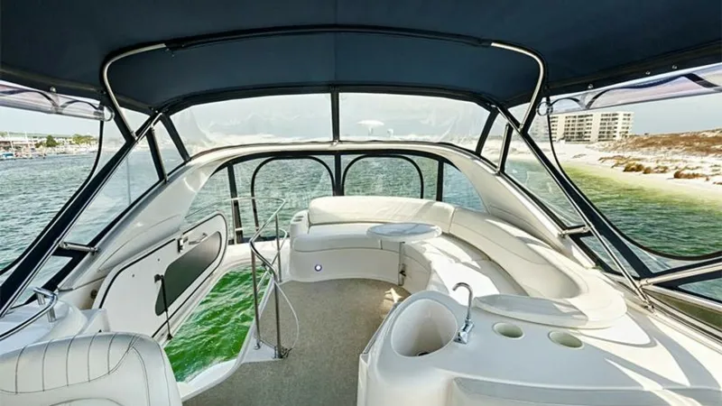 Slide: The Image of Flybridge Seating Area with Ocean View This spacious flybridge on the 2006 Meridian 391 Sedan offers a luxurious seating area with panoramic views of the surrounding waters. The curved seating arrangement provides ample space for relaxation and socializing, while the sturdy canopy ensures comf - 7766941
