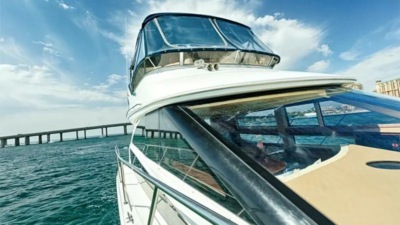 Slide: The Image of Flybridge and Foredeck View This image showcases the sleek design of the 2006 Meridian 391 Sedan's flybridge and foredeck. The spacious flybridge offers panoramic views and is equipped with a protective windshield for comfortable navigation. The foredeck features a streamlined layou - 7766950