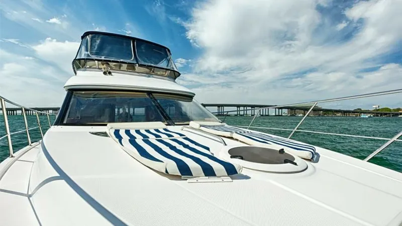 Slide: The Image of Spacious Foredeck with Sun Pads The foredeck of the 2006 Meridian 391 Sedan features comfortable sun pads, perfect for lounging and enjoying the sea breeze. The sleek design and expansive view provide an ideal spot for relaxation while underway. The deck's clean lines and sturdy railing - 7766940