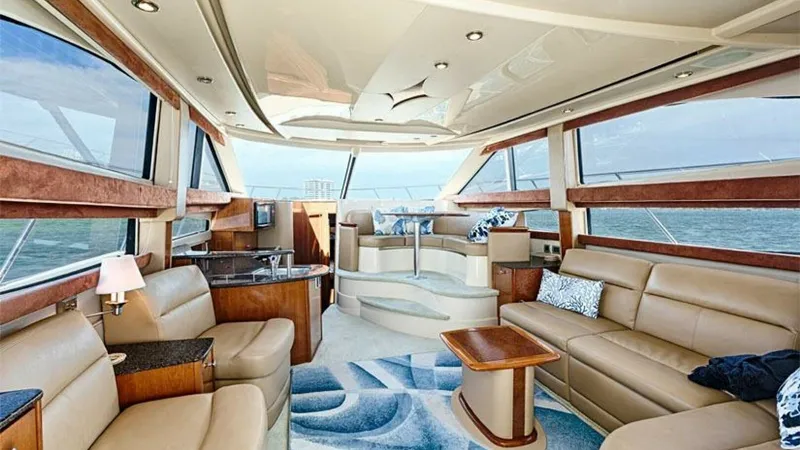 Slide: The Image of Spacious Salon with Panoramic Windows The salon of the 2006 Meridian 391 Sedan offers a luxurious and inviting space with expansive panoramic windows that provide breathtaking views. Plush leather seating and elegant wood finishes create a sophisticated atmosphere, while the open layout enhan - 7766915