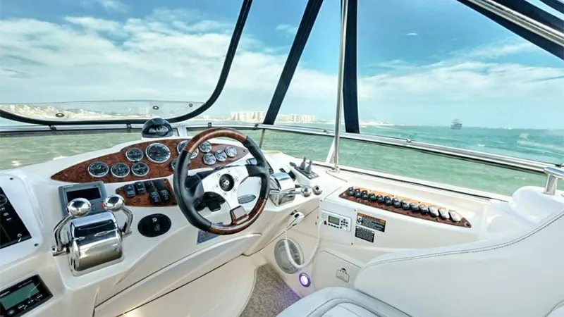 Slide: The Image of Helm Station with Panoramic Views The helm station of the 2006 Meridian 391 Sedan offers a commanding view with its expansive windshield and modern controls. The polished wood accents and ergonomic design ensure both functionality and style. Enjoy seamless navigation with easy access to a - 7766931