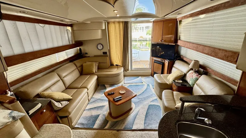 Slide: The Image of Spacious Interior Salon with Seating The 2006 Meridian 391 Sedan features a luxurious interior salon with ample seating. The space is adorned with plush leather couches, warm wood accents, and large windows that fill the area with natural light. A central table and a modern entertainment sys - 7824244