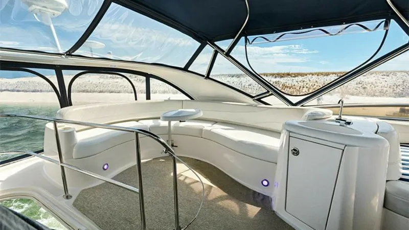 Slide: The Image of Flybridge Seating Area with Wet Bar This inviting flybridge on the 2006 Meridian 391 Sedan features a spacious seating area with plush, curved benches ideal for socializing and relaxing. The area is complemented by a convenient wet bar, perfect for entertaining guests while enjoying panoram - 7766942