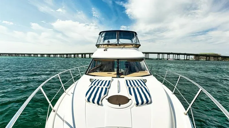 Slide: The Image of Foredeck with Sun Loungers The foredeck of the 2006 Meridian 391 Sedan features elegant striped sun loungers, perfect for relaxing under the sun. The sleek, curved lines of the deck lead to a spacious flybridge, offering panoramic views of the surrounding waters. Stainless steel ra - 7766939