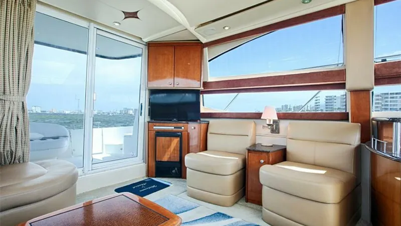 Slide: The Image of Spacious Interior Salon with Views The salon of the 2006 Meridian 391 Sedan offers a luxurious and inviting space with panoramic windows that flood the area with natural light and provide stunning views. The plush seating and elegant wood finishes create a sophisticated atmosphere, perfect - 7766916