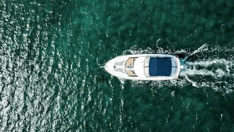 Slide: The Image of Aerial View of Meridian 391 Sedan This stunning aerial shot captures the sleek design of the 2006 Meridian 391 Sedan as it glides effortlessly through the water. The expansive flybridge and spacious foredeck are highlighted, showcasing the yacht's well-thought-out layout and stylish desig - 7766959