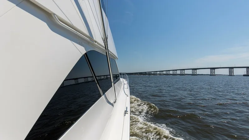 Slide: The Image of 2007 64 Viking Enclosed Bridge Reel Blues Starboard Side - 7795346