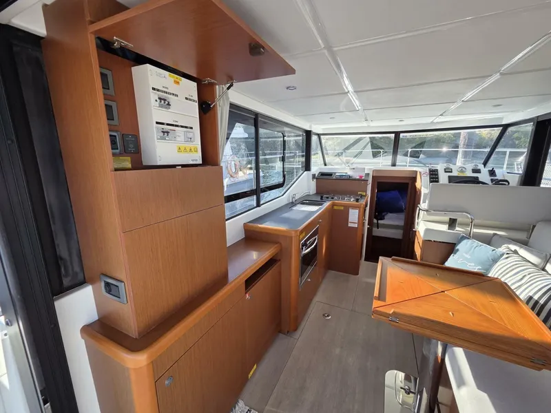 Slide: The Image of Interior of 2020 Beneteau Swift Trawler 30, featuring large galley and seating with custom table - 7818222