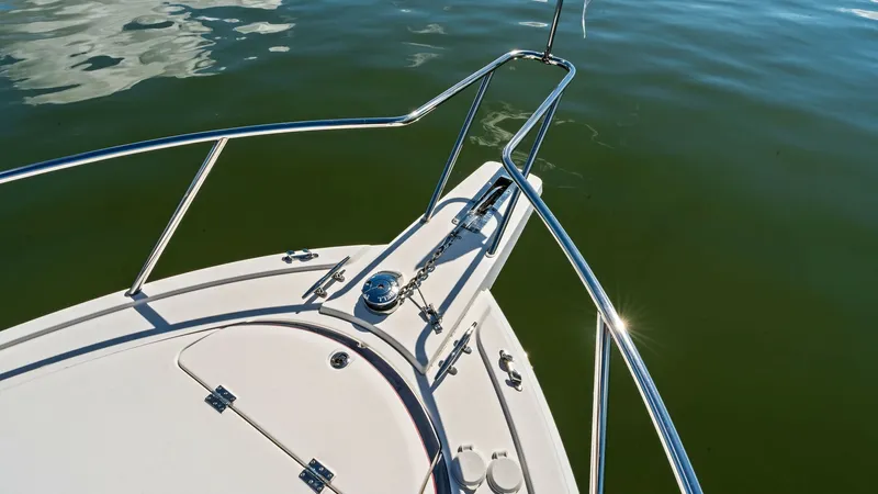 Slide: The Image of Bow with Anchor and Railings The bow of the 2019 Bertram 35 Flybridge, featuring sleek stainless steel railings and a robust anchor system, is designed for both style and functionality. The expansive deck area provides ample space for maneuvering and relaxing while offering a clear v - 7851542