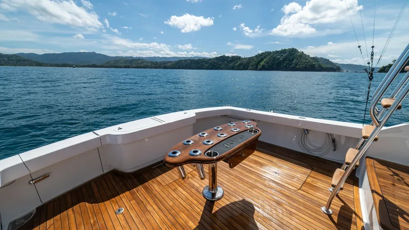 Slide: The Image of Spacious Aft Deck with Rod Holders The aft deck of the 2020 Viking 46 BF, JUJU, boasts a beautifully crafted teak floor, offering a luxurious and durable finish. Central to this space is a well-equipped fishing station with multiple rod holders, ideal for sport fishing enthusiasts. The ope - 7854761