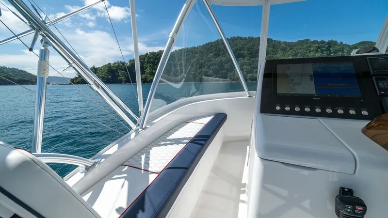 Slide: The Image of Flybridge Helm with Scenic View The flybridge helm of the 2020 Viking 46 BF offers a commanding view of the surrounding waters. The helm is equipped with state-of-the-art navigation controls and a sleek, modern dashboard. Comfortable seating provides an excellent spot for enjoying the j - 7854772