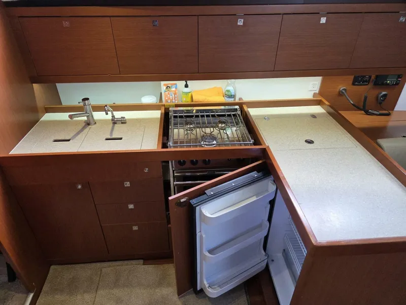 Slide: The Image of Galley with fridge, freezer, stove, oven, and double sink - 7937463