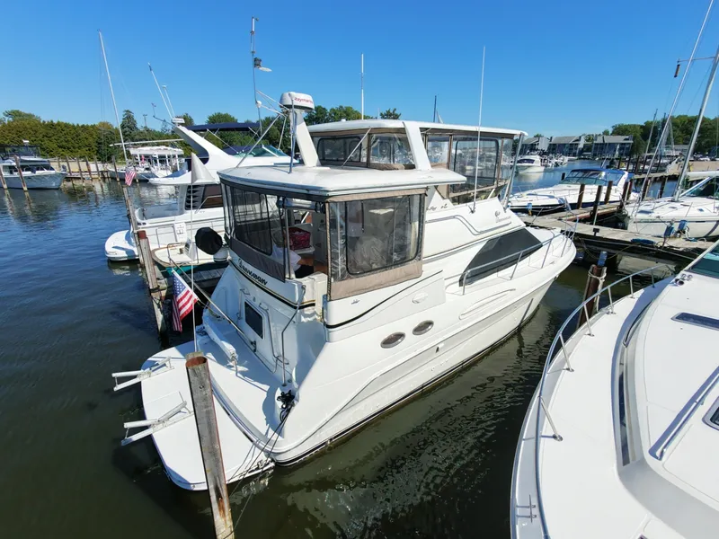 Slide: The Image of Starboard Bow Profile Starboard bow view showcasing forward deck lines and full enclosure canvas. - 7926117