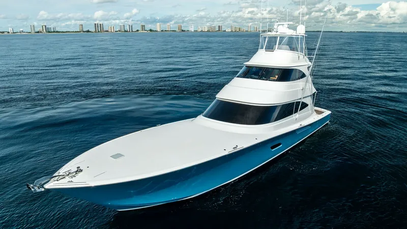 Slide: The Image of Aerial View of Bow and Superstructure This image showcases the sleek and powerful design of the 2017 Viking 80 Convertible. The expansive bow and modern superstructure highlight its robust performance capabilities and refined elegance. The vessel's striking blue hull contrasts beautifully wit - 7932718