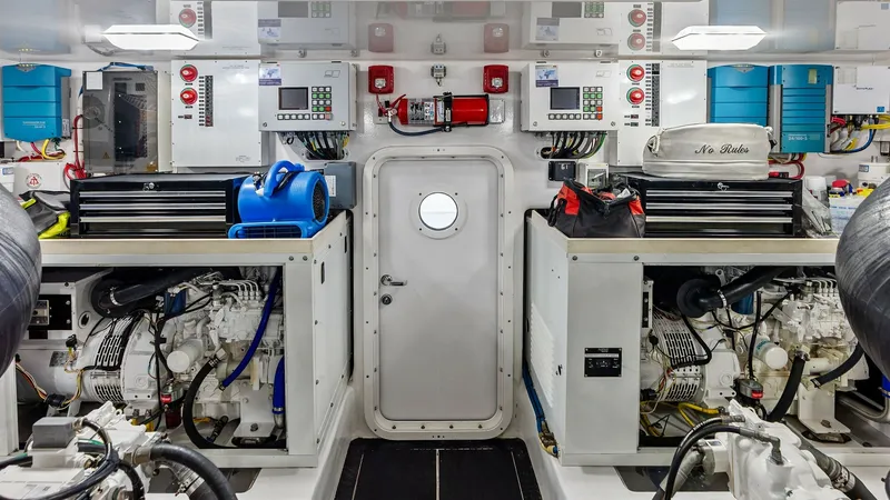 Slide: The Image of Engine Room with Dual Engines The engine room of the 2017 Viking 80 Convertible features dual high-performance engines, arranged neatly for optimal access and maintenance. The space is well-organized, with tool storage and control panels easily accessible, ensuring that operational ef - 7932713