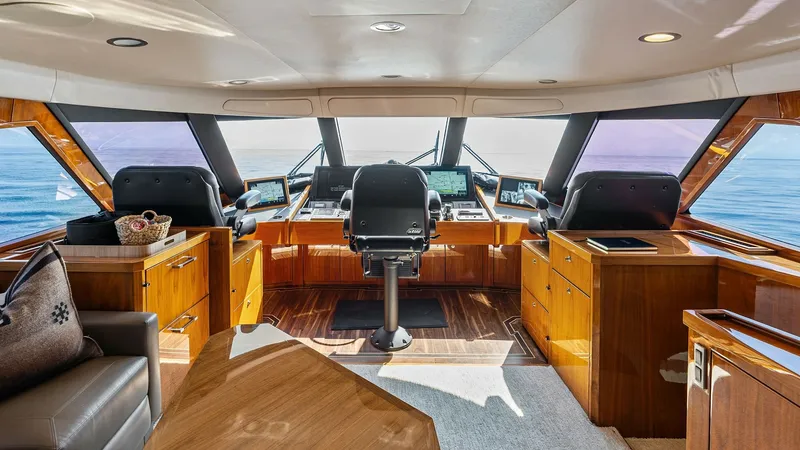 Slide: The Image of Spacious Helm with Panoramic Views The helm of the 2017 Viking 80 Convertible offers a commanding view with expansive windows and state-of-the-art navigation systems. Rich wood finishes and plush seating provide a luxurious and functional space for captains. Ample natural light and ergonom - 7932680