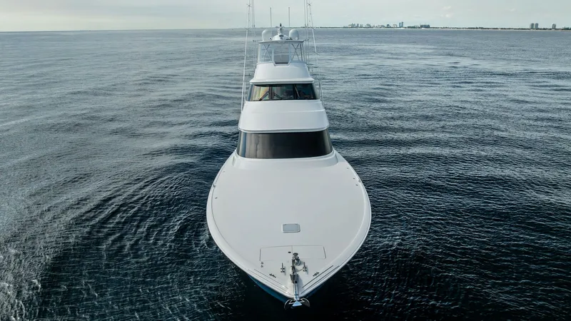 Slide: The Image of Bow View of Viking 80 Convertible This striking bow view of the 2017 Viking 80 Convertible showcases its sleek and powerful design, cutting through the water with grace. The expansive foredeck offers a clean and streamlined appearance, emphasizing the yacht's elegant profile. With its rob - 7932717