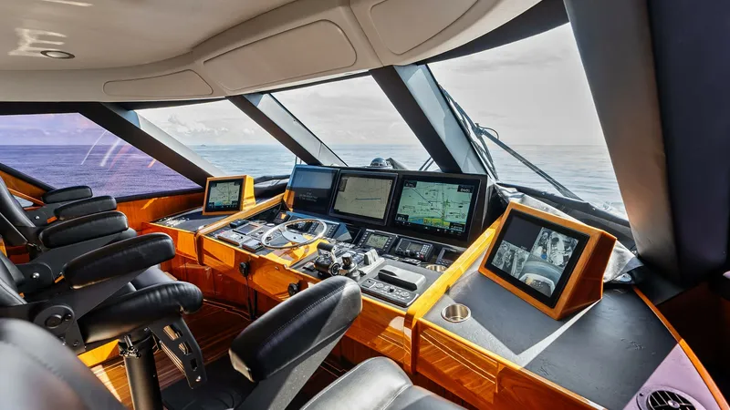 Slide: The Image of Spacious Helm with Advanced Navigation The helm of the 2017 Viking 80 Convertible 'Aussie Rules' exudes sophistication and functionality. Featuring state-of-the-art navigation systems and multiple digital displays, it ensures a seamless and informed cruising experience. The ergonomic captain's - 7932643