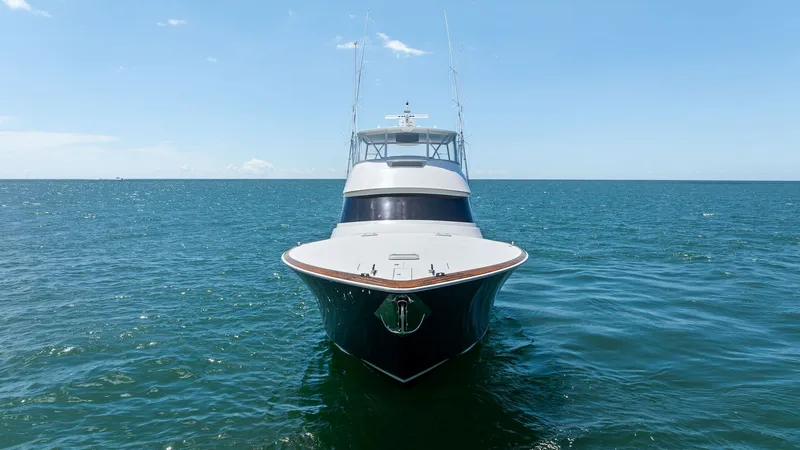 Slide: The Image of Bow View on Open Water The 2024 Viking 68 Convertible 'Laid Back' showcases a sleek and powerful bow design, cutting through the open water with ease. The clean lines and robust construction highlight its superior craftsmanship and performance capabilities. This view emphasizes - 7933170