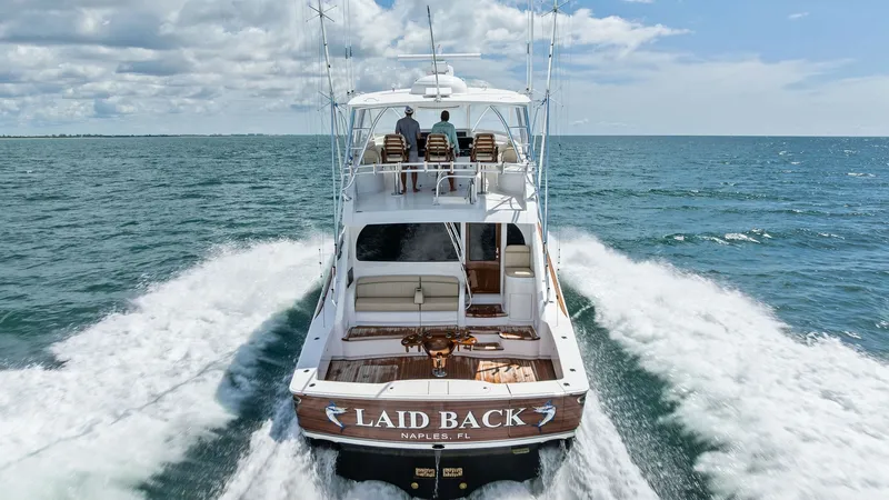 Slide: The Image of Aft Deck and Cockpit View This image showcases the aft deck and cockpit of the 2024 Viking 68 Convertible 'Laid Back.' The spacious cockpit is designed for both relaxation and functionality, featuring comfortable seating and ample space for fishing or entertaining. The vessel's sl - 7933179