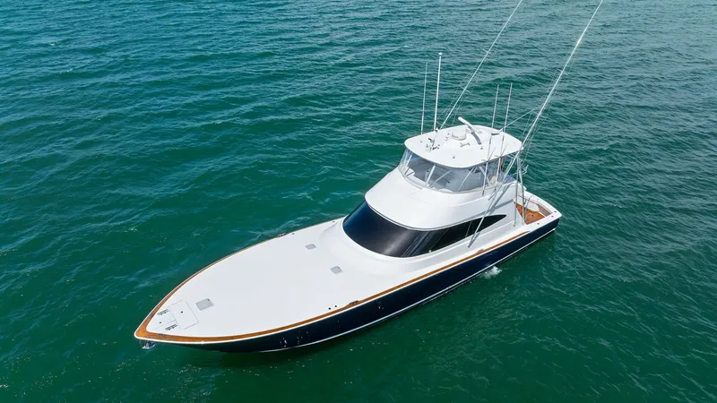 Slide: The Image of Aerial View of Flybridge and Bow This stunning aerial shot showcases the sleek design of the 2024 Viking 68 Convertible. The spacious flybridge is equipped with advanced navigation equipment, while the expansive bow offers ample room for relaxation. The vessel's elegant lines and pristin - 7933175