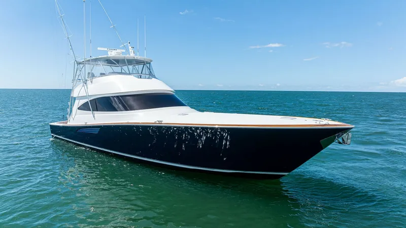 Slide: The Image of Bow View of Viking 68 Convertible The 2024 Viking 68 Convertible 'Laid Back' showcases a sleek and powerful bow design, cutting through the water with ease. The yacht's dark hull contrasts elegantly with the bright superstructure, while large windows provide ample natural light and stunni - 7933169