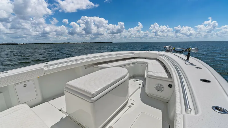 Slide: The Image of Spacious Bow Seating Area The 2014 Yellowfin 39 Center Console features a well-appointed bow with ample cushioned seating, perfect for relaxation and enjoying panoramic ocean views. The sleek design includes a central console that offers additional seating and storage options. Hig - 7943329