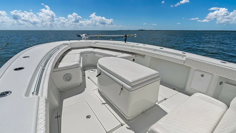 Slide: The Image of Spacious Bow Seating Area The 2014 Yellowfin 39 Center Console features a well-appointed bow seating area with plush cushions, perfect for relaxation. The clean, white finish enhances the modern aesthetic, while ample storage beneath the seats adds practicality. Enjoy panoramic oc - 7943327