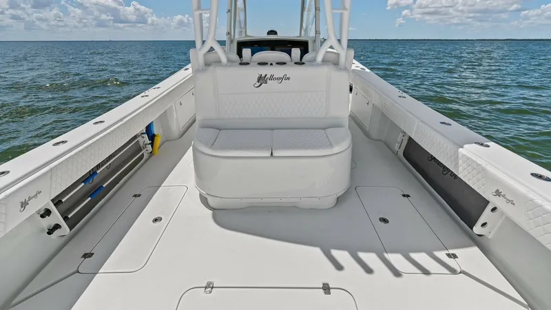 Slide: The Image of Spacious Aft Deck Seating Area This 2014 Yellowfin 39 Center Console features a spacious aft deck with comfortable seating, ideal for relaxing or entertaining. The clean, white finishes create a bright and inviting atmosphere, complemented by ample storage space along the sides. Enjoy - 7943310