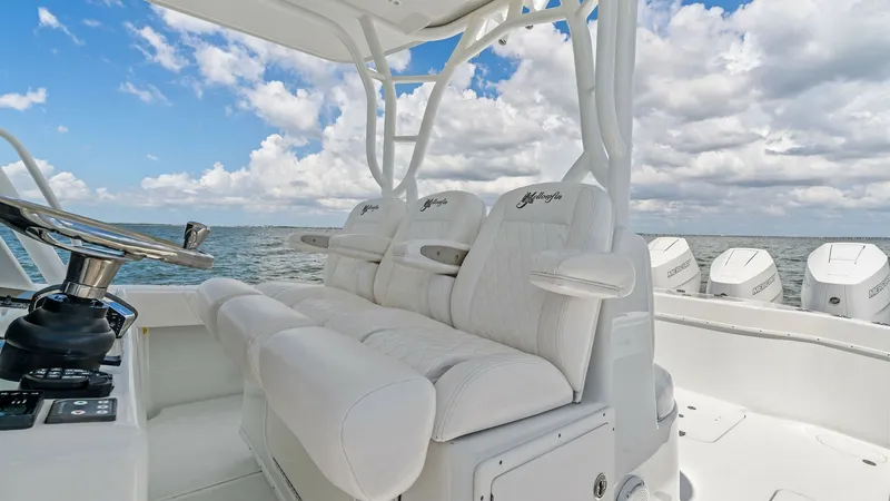 Slide: The Image of Center Console Helm Seating This 2014 Yellowfin 39 Center Console features luxurious helm seating with plush, contoured cushions for maximum comfort. The ergonomic design includes armrests and ample legroom, ensuring a relaxed experience while navigating. The helm's strategic layout - 7943318