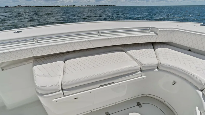 Slide: The Image of Bow Seating Area The bow of the 2014 Yellowfin 39 Center Console features plush, diamond-stitched upholstery, offering both comfort and style. This spacious seating area provides ample room for relaxation, with a panoramic view of the open sea. The elegant design and high - 7943330
