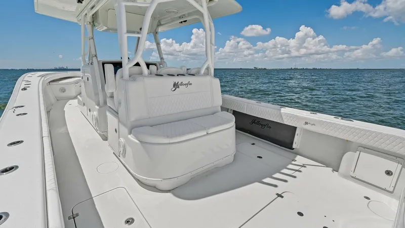 Slide: The Image of Spacious Aft Deck with Seating The aft deck of the 2014 Yellowfin 39 Center Console features ample seating and a clean, open layout. The white upholstery and non-slip deck provide a comfortable and safe environment for passengers. With unobstructed views of the water, this area is perf - 7943312