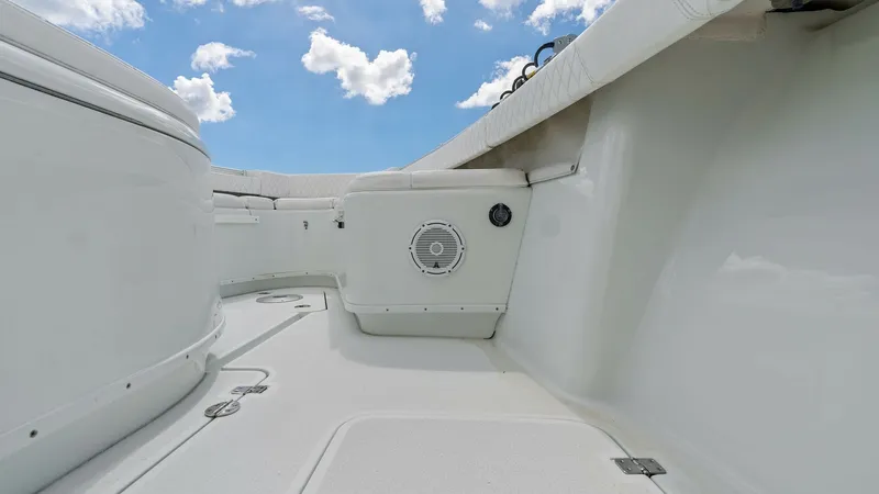 Slide: The Image of Spacious Bow Seating Area The 2014 Yellowfin 39 Center Console features a spacious bow seating area, perfect for relaxation and socializing. This area is equipped with plush upholstery and integrated speakers, enhancing the onboard entertainment experience. The sleek, white finish - 7943338