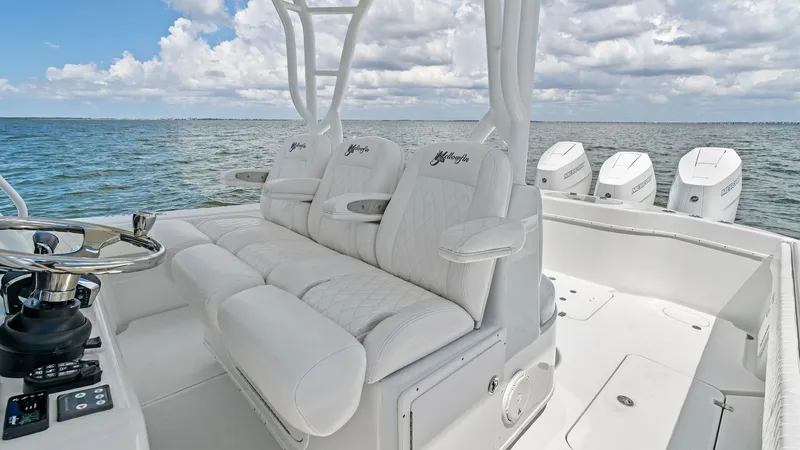 Slide: The Image of Center Console Helm Seating Area The 2014 Yellowfin 39 Center Console features a luxurious helm seating area with plush, contoured cushions for maximum comfort. The ergonomic design includes three individual seats with armrests, providing excellent visibility and control for the captain. - 7943319