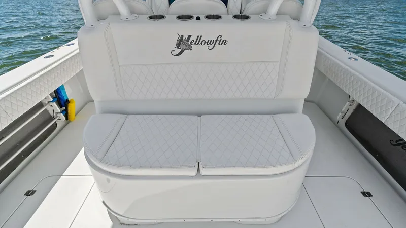 Slide: The Image of Aft Seating with Storage Bench The aft seating area of the 2014 Yellowfin 39 Center Console features plush, diamond-stitched cushions for maximum comfort. The seating includes a convenient storage bench, providing ample space for gear and essentials. The clean white upholstery and slee - 7943315