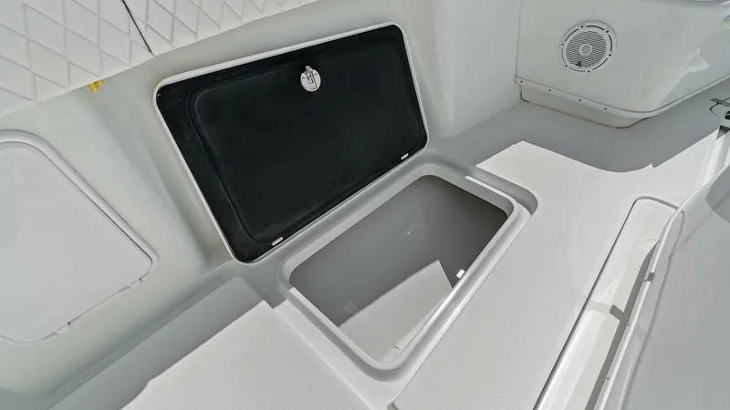 Slide: The Image of In-Deck Storage Compartment Access This image showcases the spacious in-deck storage compartment on the 2014 Yellowfin 39 Center Console. The compartment is easily accessible, ideal for storing gear and essentials while ensuring a clutter-free deck. The surrounding area features durable, n - 7943337