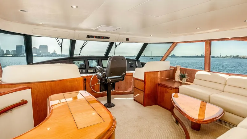 Slide: The Image of 2014 Viking 76 Enclosed Bridge "TRANQUILO" The enclosed bridge of the 2014 Viking 76 Enclosed Bridge Sportfisher offers a sophisticated helm station with state-of-the-art navigation equipment. Luxurious leather seating and rich wood finishes create an inviting lounge area, providing panoramic view - 7962469