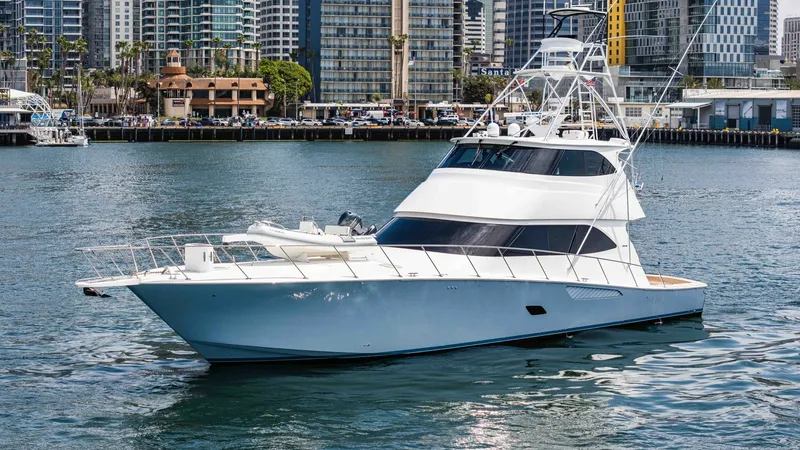 Slide: The Image of 2014 Viking 76 Enclosed Bridge "TRANQUILO" This image showcases the sleek and powerful profile of the 2014 Viking 76 Enclosed Bridge Sportfisher. The vessel's elegant lines and robust structure are highlighted, with the enclosed bridge offering protection and comfort. Its spacious foredeck and the - 7962516