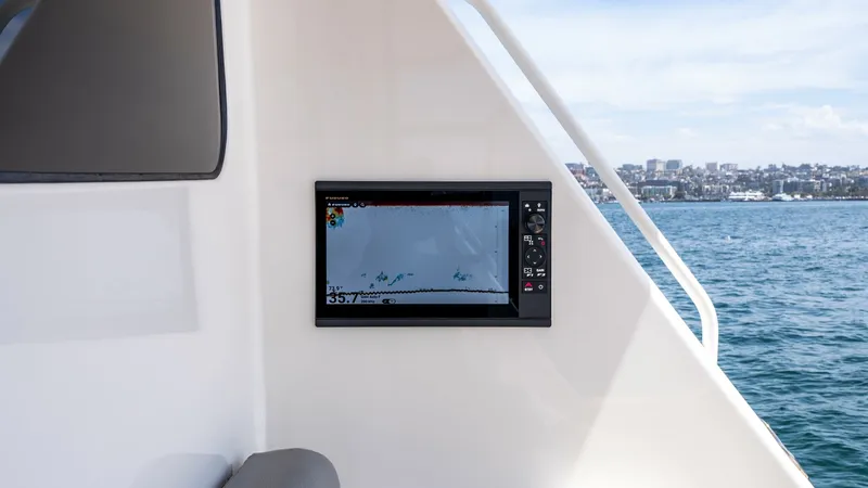 Slide: The Image of 2014 Viking 76 Enclosed Bridge "TRANQUILO" This image showcases the sleek navigation station on the flybridge of the 2014 Viking 76 Enclosed Bridge Sportfisher. The integrated display provides clear and precise data, ensuring smooth navigation during your fishing adventures. The station is strateg - 7962513